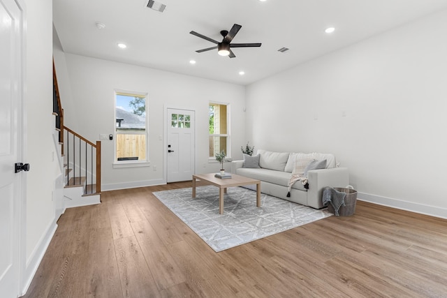 5306 San Juan St, Houston, TX 77020 - living area featuring wood finished floors, stairs, ceiling fan, baseboards, and recessed lighting