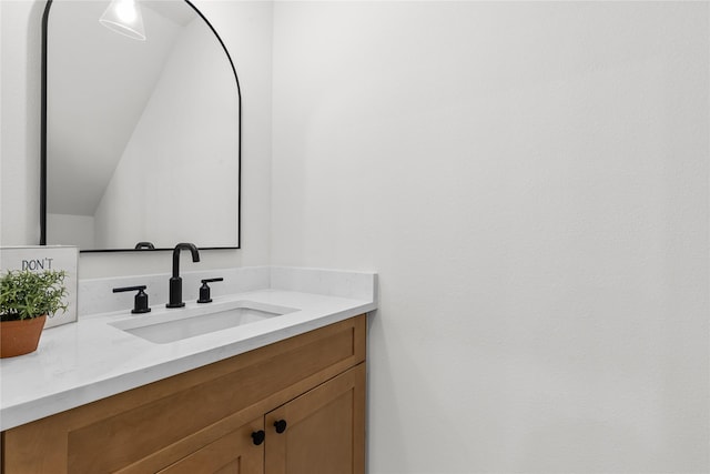 5306 San Juan St, Houston, TX 77020 - bathroom featuring vanity and vaulted ceiling