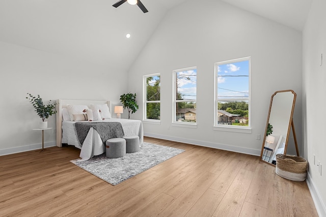 5306 San Juan St, Houston, TX 77020 - bedroom with high vaulted ceiling, wood finished floors, baseboards, and a ceiling fan