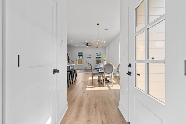 5306 San Juan St, Houston, TX 77020 - foyer entrance with stairway, light wood-style flooring, a chandelier, recessed lighting, and baseboards