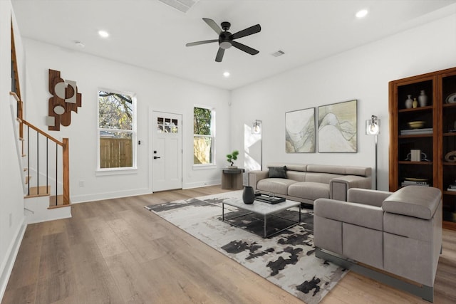 5306 San Juan St, Houston, TX 77020 - living room with wood finished floors, stairs, a ceiling fan, recessed lighting, and baseboards