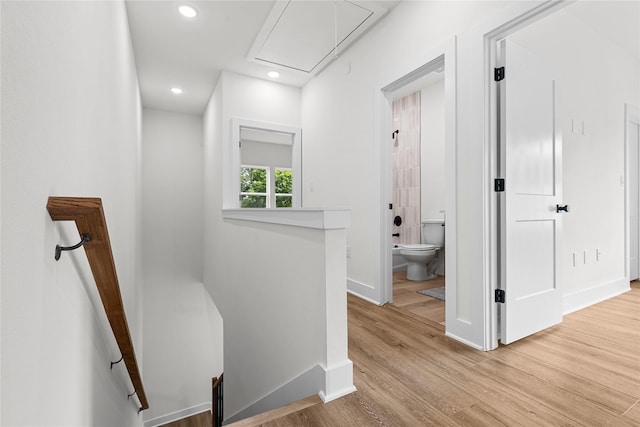 5306 San Juan St, Houston, TX 77020 - hallway with attic access, baseboards, an upstairs landing, light wood-style floors, and recessed lighting