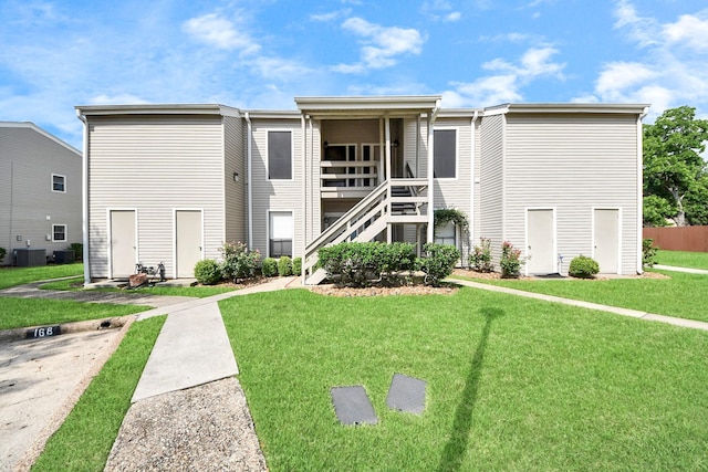 170 April Point Dr N Unit 170, Conroe, TX 77356 - view of building exterior with stairway and central air condition unit