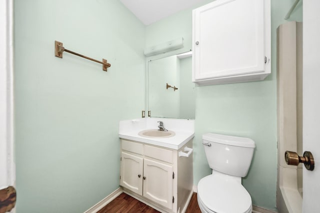 170 April Point Dr N Unit 170, Conroe, TX 77356 - full bathroom featuring vanity, toilet, baseboards, and wood finished floors