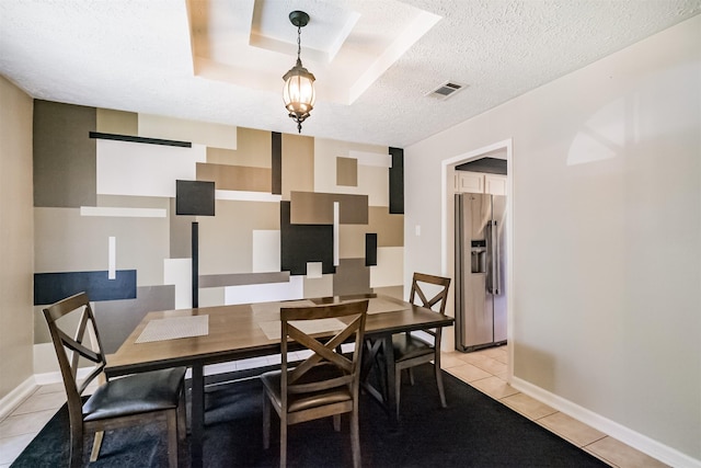 1510 Elmscott Dr, Sugar Land, TX 77498 - dining room featuring light tile patterned flooring, a textured ceiling, and baseboards