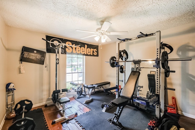 1510 Elmscott Dr, Sugar Land, TX 77498 - workout area with a textured ceiling, ceiling fan, baseboards, and wood finished floors