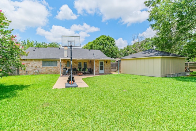 1510 Elmscott Dr, Sugar Land, TX 77498 - back of property featuring a patio area and brick siding