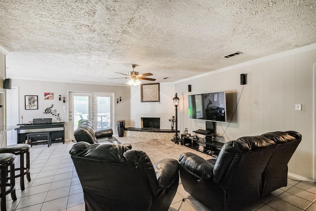1510 Elmscott Dr, Sugar Land, TX 77498 - living area featuring a ceiling fan, light tile patterned floors, a brick fireplace, crown molding, and a textured ceiling