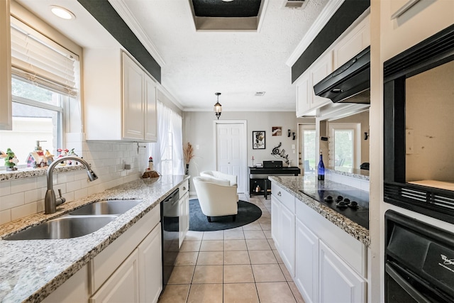1510 Elmscott Dr, Sugar Land, TX 77498 - kitchen with a sink, black appliances, white cabinetry, backsplash, and ornamental molding
