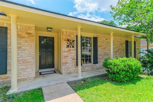 1510 Elmscott Dr, Sugar Land, TX 77498 - view of exterior entry featuring brick siding and covered porch