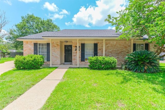 1510 Elmscott Dr, Sugar Land, TX 77498 - ranch-style house featuring covered porch, brick siding, and a shingled roof