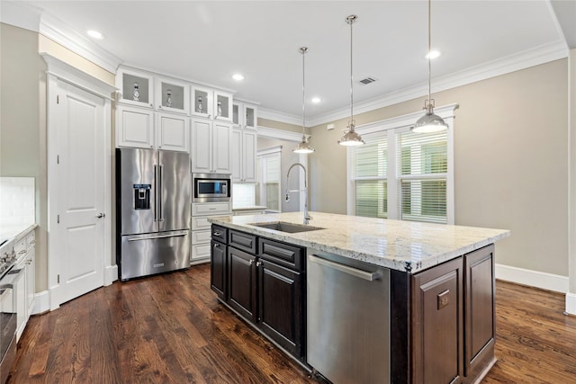 428 W 26th St, Houston, TX 77008 - kitchen with appliances with stainless steel finishes, a sink, white cabinetry, glass insert cabinets, and crown molding