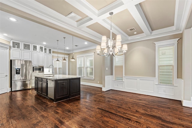 428 W 26th St, Houston, TX 77008 - kitchen featuring stainless steel appliances, a chandelier, a center island with sink, ornamental molding, and dark wood-type flooring