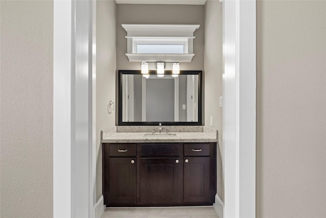 428 W 26th St, Houston, TX 77008 - bathroom with vanity, tile patterned flooring, and baseboards