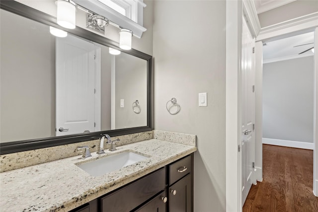 428 W 26th St, Houston, TX 77008 - bathroom featuring wood finished floors, vanity, ornamental molding, and baseboards