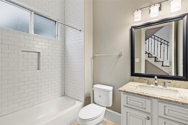428 W 26th St, Houston, TX 77008 - bathroom featuring vanity, toilet, tub / shower combination, and baseboards