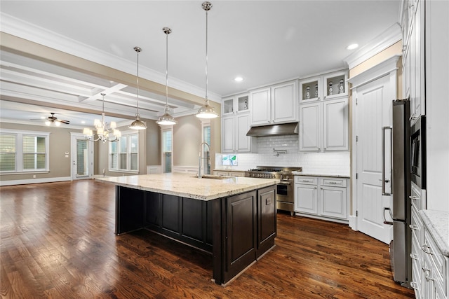 428 W 26th St, Houston, TX 77008 - kitchen featuring appliances with stainless steel finishes, a sink, under cabinet range hood, a kitchen island with sink, and a chandelier
