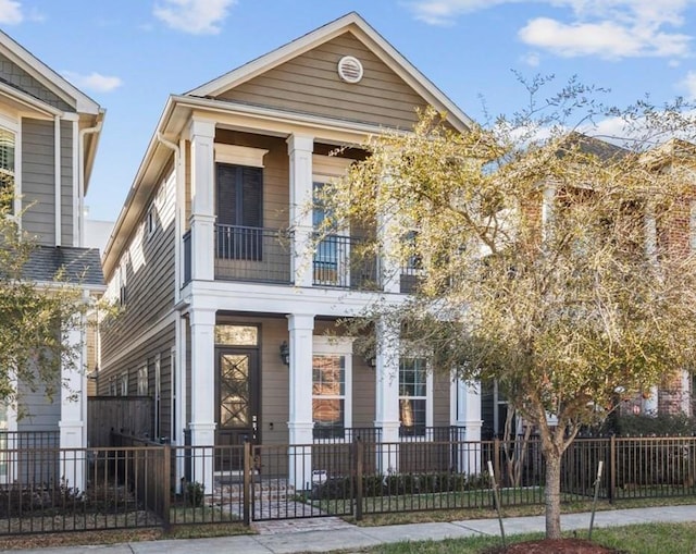 428 W 26th St, Houston, TX 77008 - view of front of property featuring a balcony, a porch, and a fenced front yard