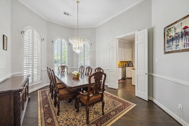 13627 Ashley Run, Houston, TX 77077 - dining area featuring a chandelier, baseboards, ornamental molding, and dark wood-type flooring