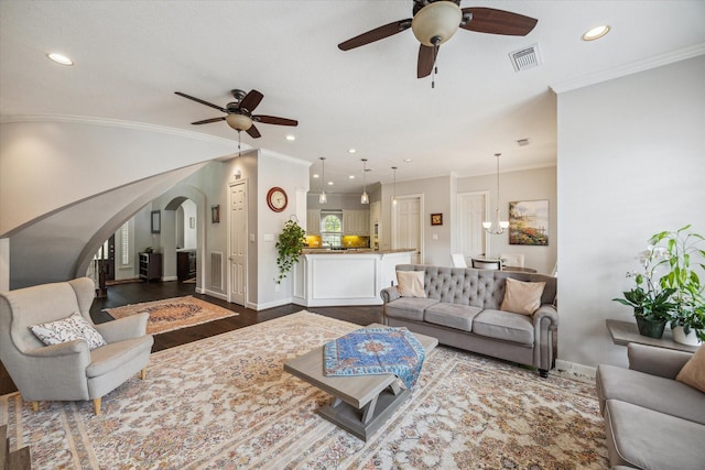 13627 Ashley Run, Houston, TX 77077 - living area with a ceiling fan, baseboards, arched walkways, ornamental molding, and recessed lighting