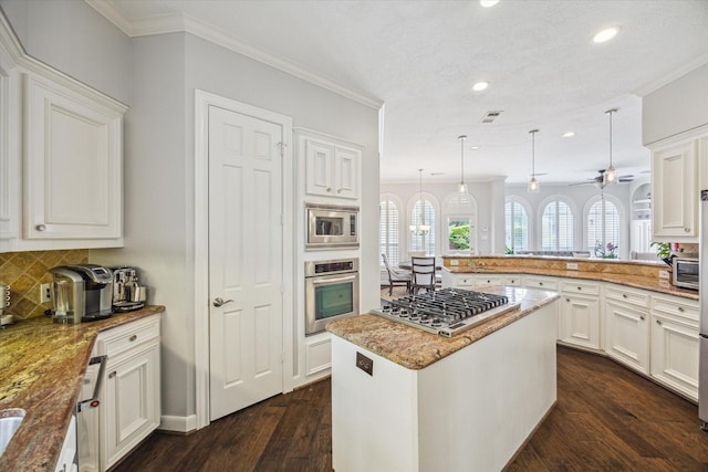 13627 Ashley Run, Houston, TX 77077 - kitchen with appliances with stainless steel finishes, recessed lighting, crown molding, dark wood-type flooring, and decorative backsplash