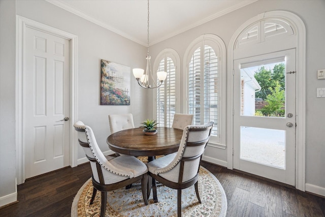 13627 Ashley Run, Houston, TX 77077 - dining space featuring a chandelier, dark wood-style flooring, ornamental molding, and baseboards