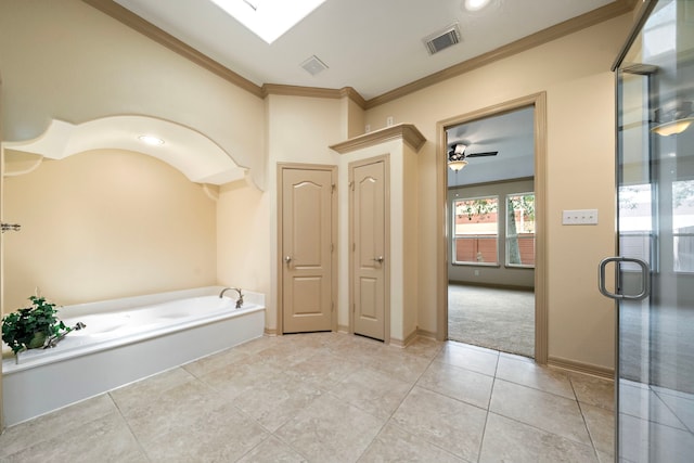 6823 Rosemont Park Ln, Katy, TX 77494 - bathroom with ornamental molding, a bath, tile patterned floors, ceiling fan, and baseboards