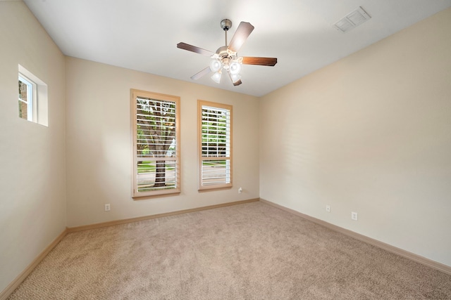 6823 Rosemont Park Ln, Katy, TX 77494 - carpeted spare room featuring plenty of natural light, a ceiling fan, and baseboards