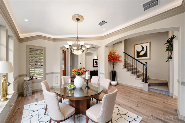 6823 Rosemont Park Ln, Katy, TX 77494 - dining room with arched walkways, stairs, light wood-type flooring, a chandelier, and recessed lighting