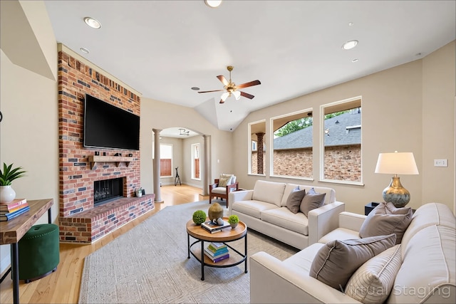 6823 Rosemont Park Ln, Katy, TX 77494 - living room featuring ornate columns, a ceiling fan, wood finished floors, arched walkways, and recessed lighting
