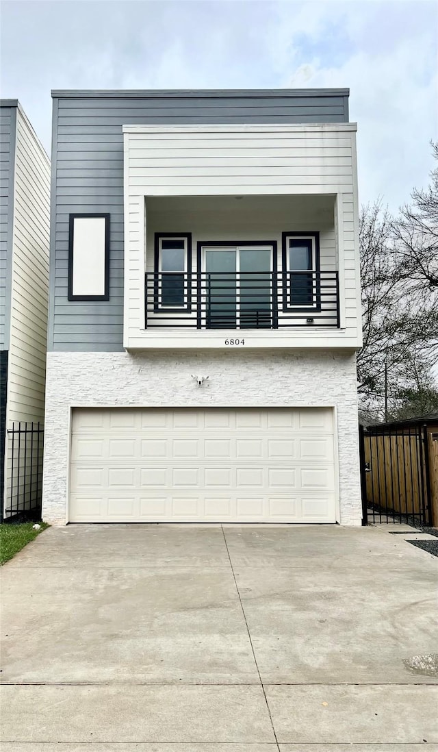 6804 Foster St, Houston, TX 77021 - contemporary home with a balcony, a garage, and concrete driveway