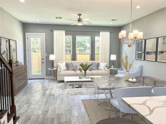 6804 Foster St, Houston, TX 77021 - living room with ceiling fan, wood finished floors, a chandelier, and recessed lighting