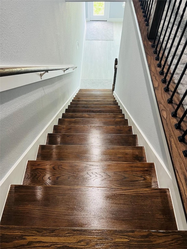 6804 Foster St, Houston, TX 77021 - stairs with a textured wall and baseboards