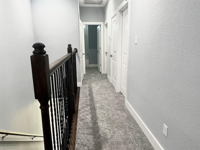 6804 Foster St, Houston, TX 77021 - hall with an upstairs landing, a textured wall, carpet, and baseboards