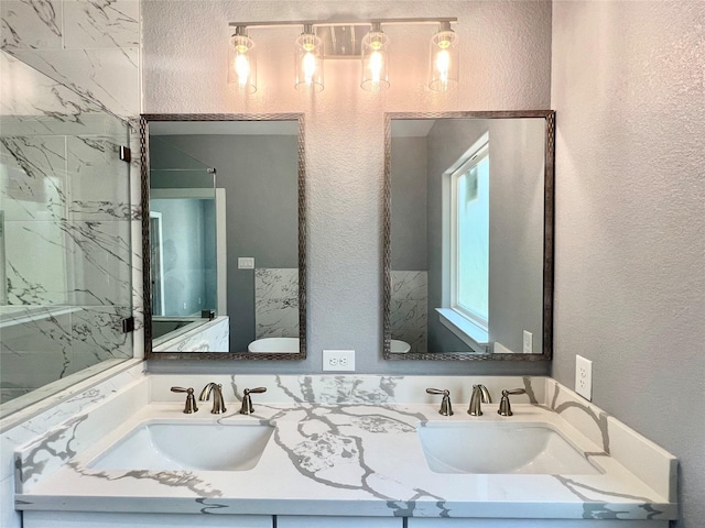 6804 Foster St, Houston, TX 77021 - full bathroom featuring a textured wall and double vanity