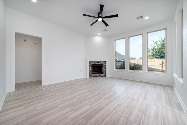 7822 Taronga Ln, Richmond, TX 77407 - unfurnished living room with a ceiling fan, a fireplace, baseboards, recessed lighting, and light wood finished floors