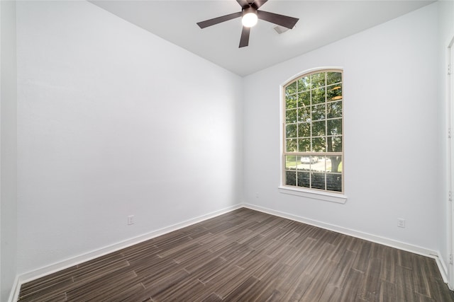 7822 Taronga Ln, Richmond, TX 77407 - spare room with dark wood finished floors, a ceiling fan, baseboards, and vaulted ceiling