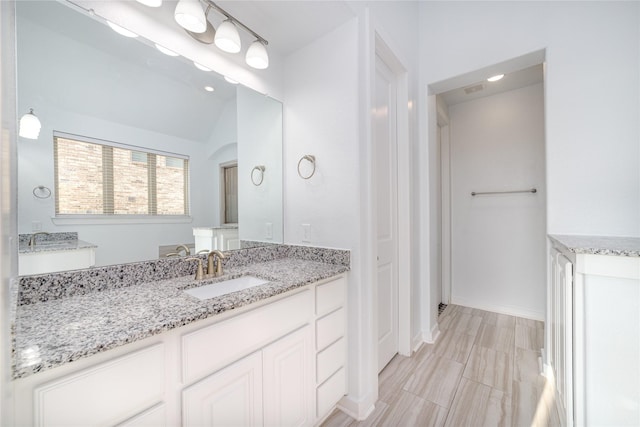 7822 Taronga Ln, Richmond, TX 77407 - bathroom with vanity and baseboards