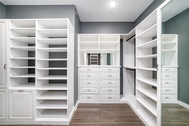 7822 Taronga Ln, Richmond, TX 77407 - walk in closet featuring dark wood-type flooring