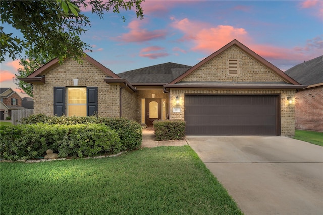 207 Lockridge Hill Ln, Richmond, TX 77469 - view of front of house featuring brick siding, a garage, driveway, and a front yard