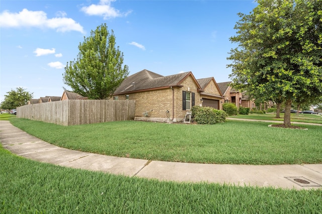 207 Lockridge Hill Ln, Richmond, TX 77469 - view of property exterior featuring brick siding, a garage, and a shingled roof