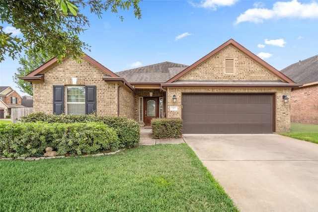 207 Lockridge Hill Ln, Richmond, TX 77469 - view of front of home featuring brick siding, an attached garage, a front yard, and concrete driveway