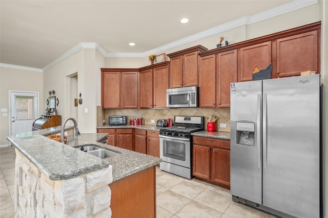 207 Lockridge Hill Ln, Richmond, TX 77469 - kitchen featuring appliances with stainless steel finishes, a sink, light stone counters, tasteful backsplash, and brown cabinets
