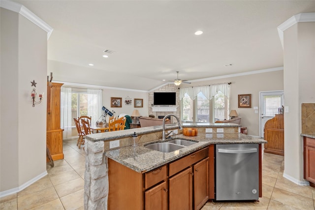 207 Lockridge Hill Ln, Richmond, TX 77469 - kitchen with dishwasher, a sink, a ceiling fan, a center island with sink, and light tile patterned floors