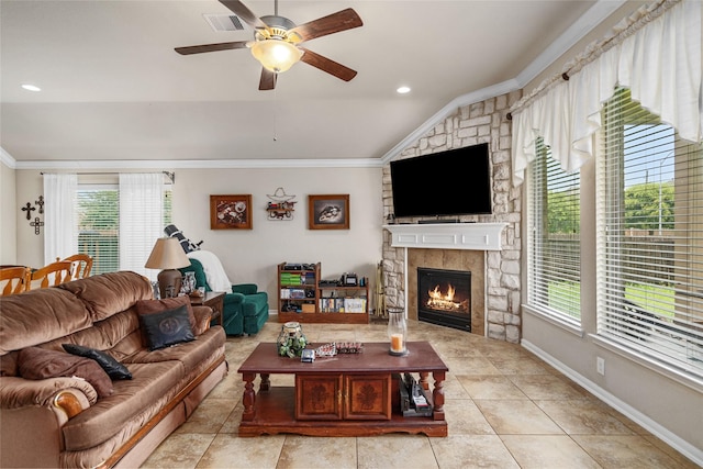 207 Lockridge Hill Ln, Richmond, TX 77469 - living area with crown molding, vaulted ceiling, a ceiling fan, a fireplace, and tile patterned flooring