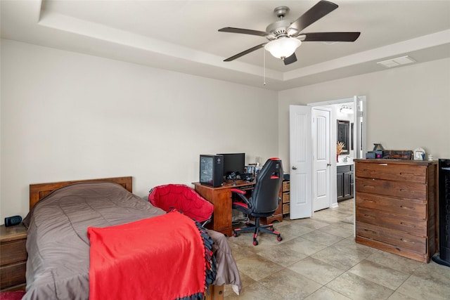 207 Lockridge Hill Ln, Richmond, TX 77469 - bedroom with a tray ceiling, an office area, ceiling fan, and ensuite bath