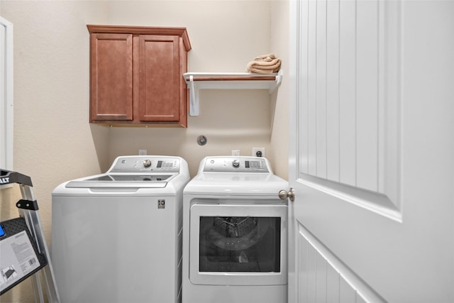 207 Lockridge Hill Ln, Richmond, TX 77469 - laundry room featuring washer and dryer and cabinet space