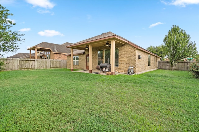 207 Lockridge Hill Ln, Richmond, TX 77469 - back of house with a ceiling fan, brick siding, and a patio