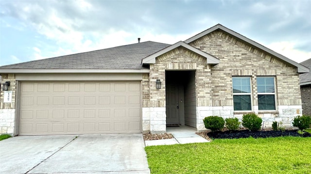13909 Payette Arbor Ct, Conroe, TX 77384 - single story home featuring driveway, stone siding, a garage, a front yard, and roof with shingles