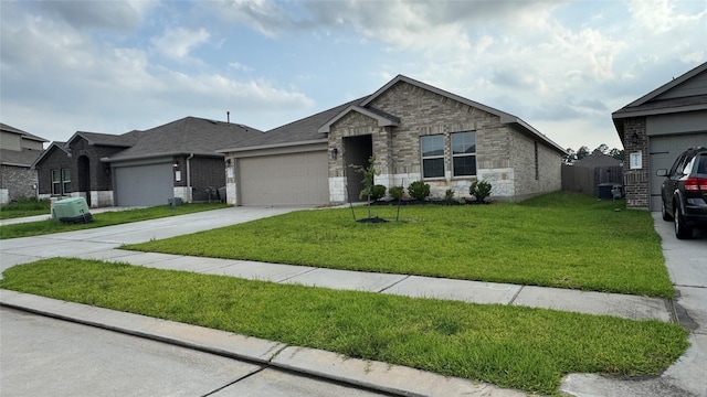 13909 Payette Arbor Ct, Conroe, TX 77384 - ranch-style house featuring a garage, driveway, and stone siding